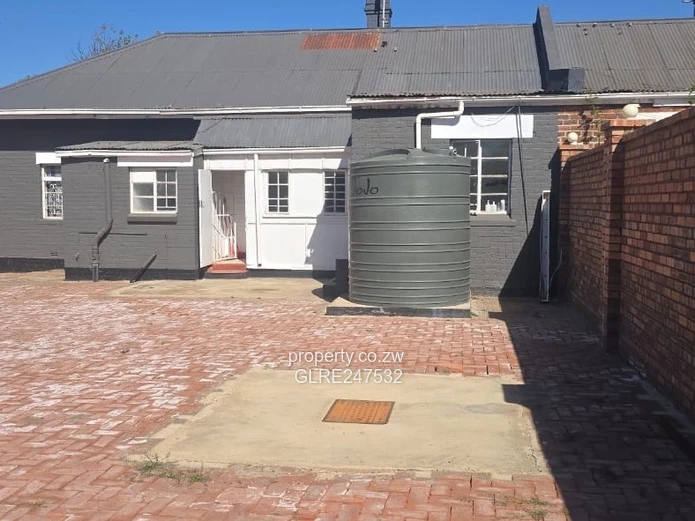 Harare CBD Office: Secure Walled Property with Paved Yard